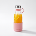 Portable rechargeable juice blender with fresh orange juice